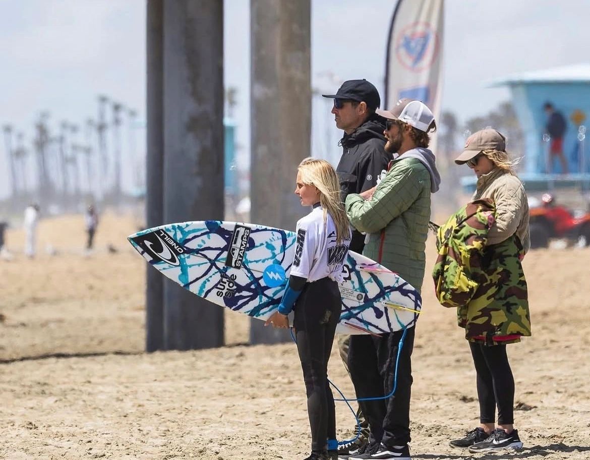 Surfer and coach at a contest
