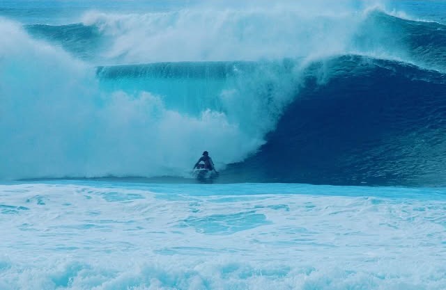 Lucas Taub riding a giant barrel at Pipeline on the North Shore of Oahu